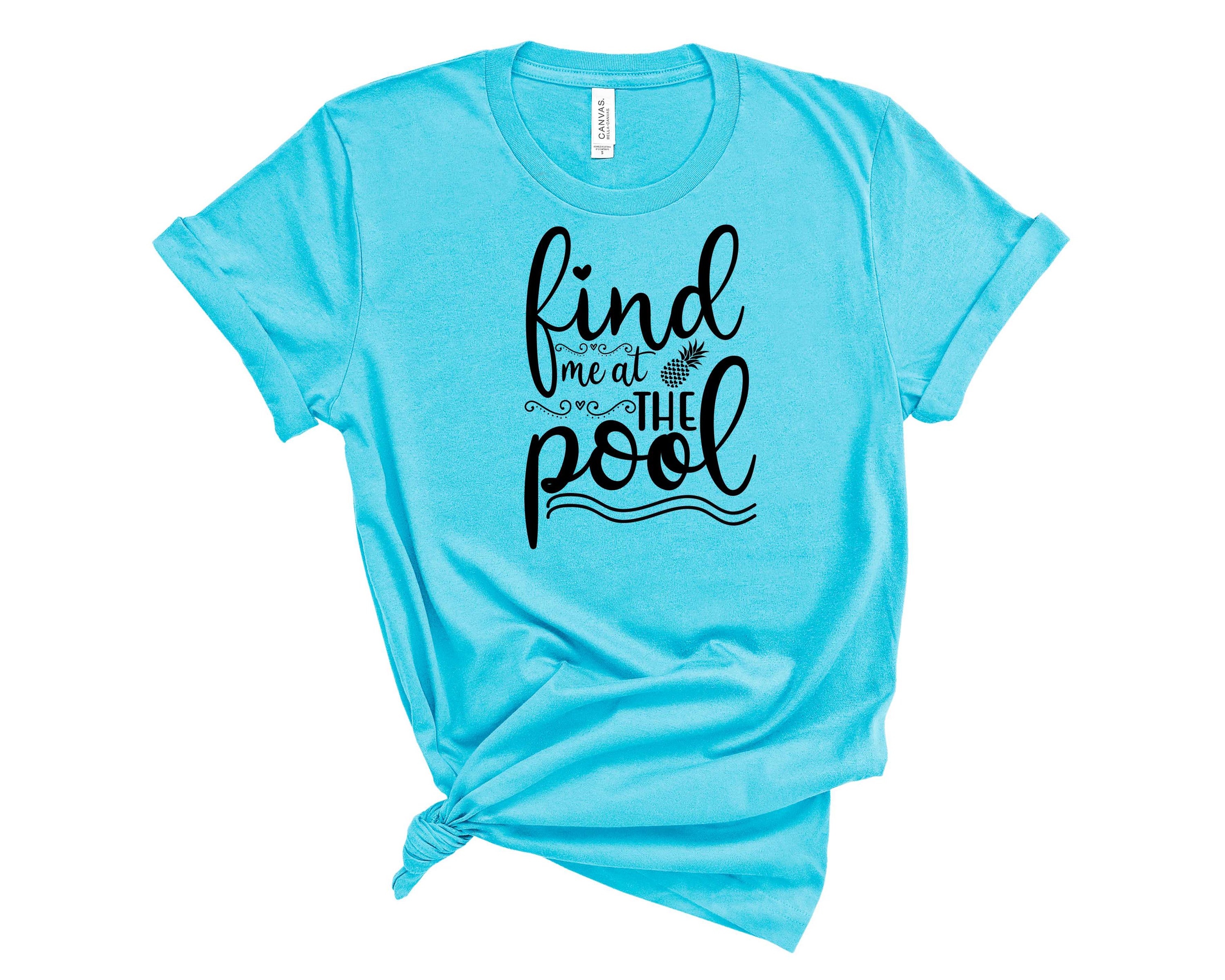 A stylish unisex graphic tee featuring the phrase 'Find me at the Pool' in vibrant colors, perfect for summer outings.