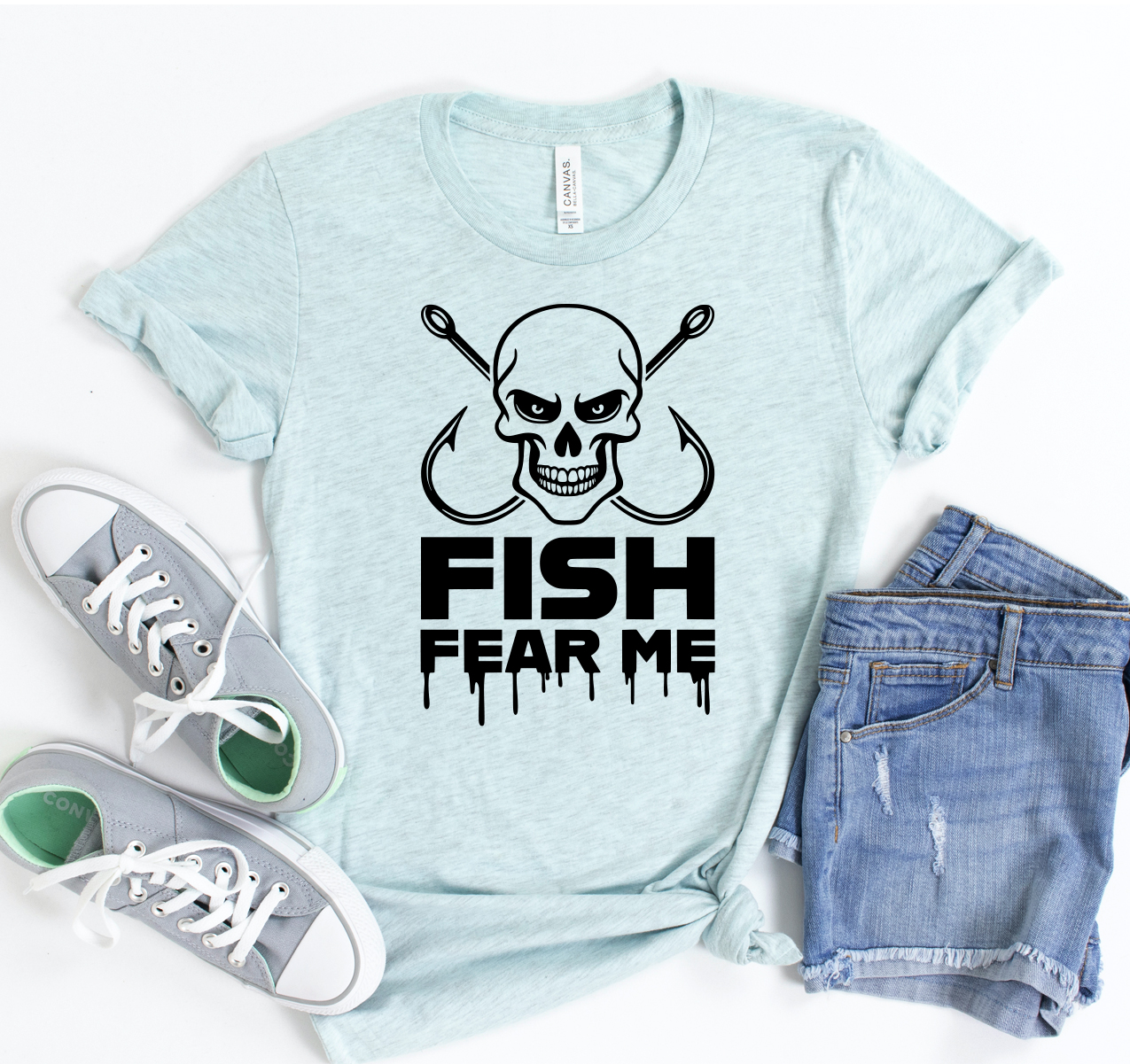 A stylish Fish Fear Me T-shirt featuring a humorous fishing slogan, made from soft cotton fabric, available in various sizes.