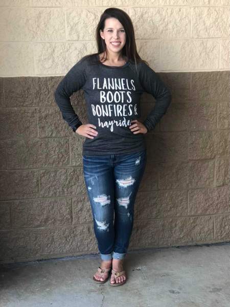 Flannels Boot Hayrides Graphic Tee featuring a cozy design perfect for autumn, showcasing flannels, boots, and hayrides.