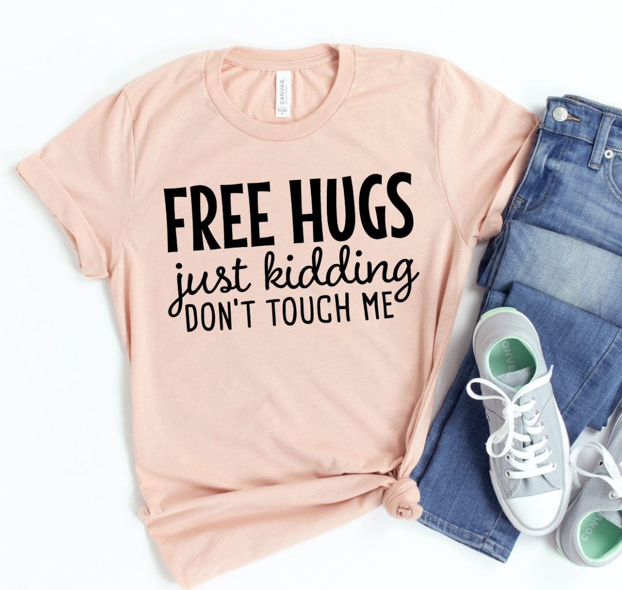 Free Hugs Just Kidding T-shirt made of premium ring spun cotton with a playful design and soft textile flex print.