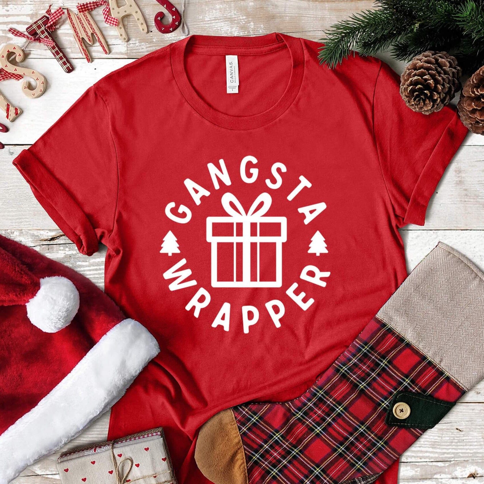 Gangsta Wrapper Christmas Tee featuring a fun holiday design, made from soft Ringspun Cotton, suitable for both men and women.