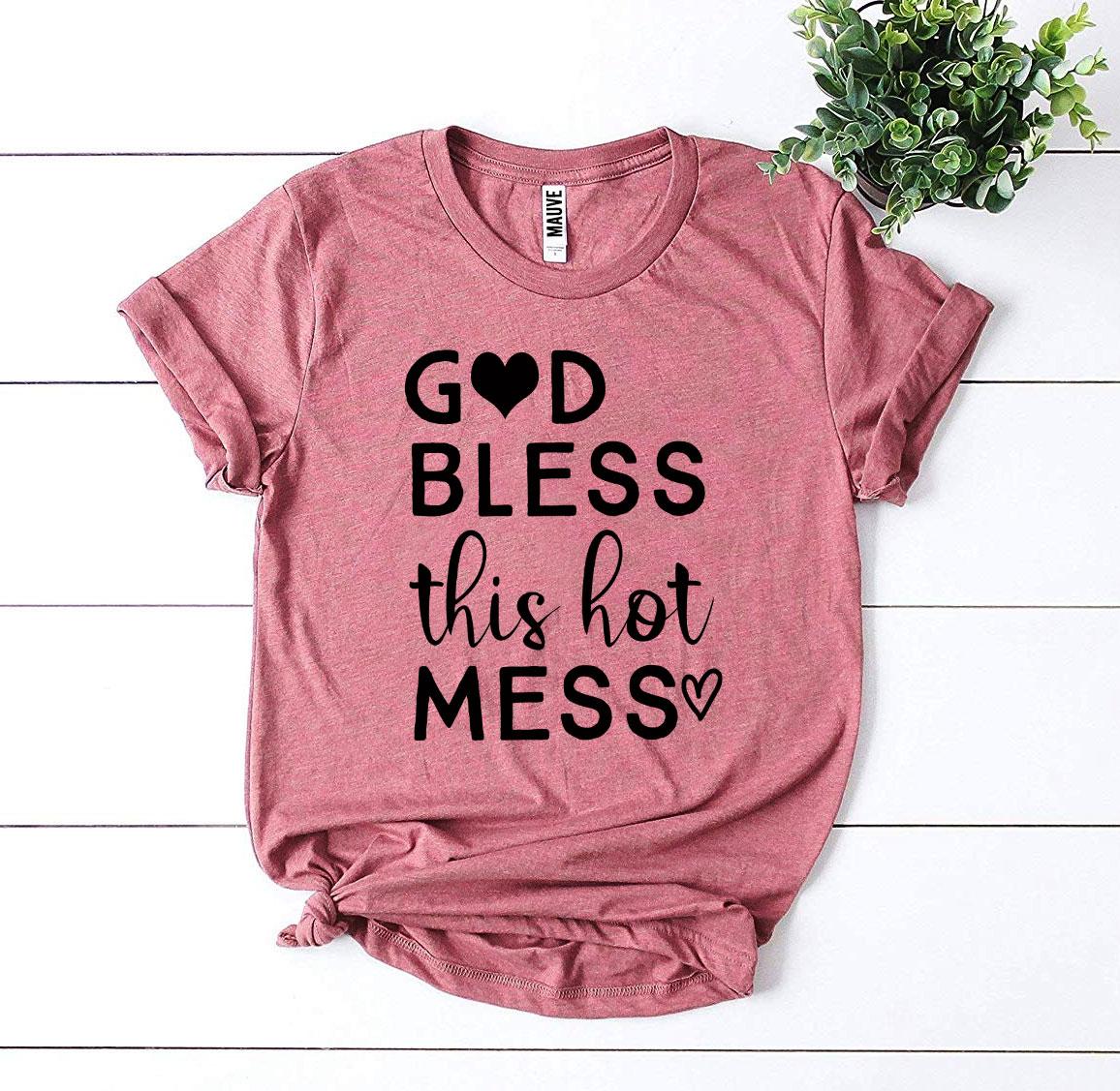 God Bless This Hot Mess T-shirt made from premium ring spun cotton with a stylish print, available in various sizes.