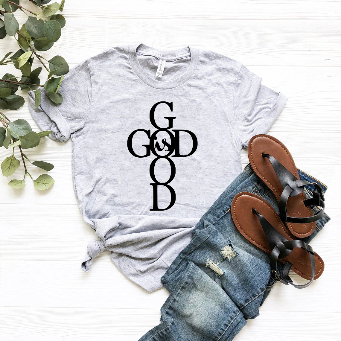 A stylish unisex God Is God Shirt made from soft ring spun cotton, available in multiple colors and sizes.