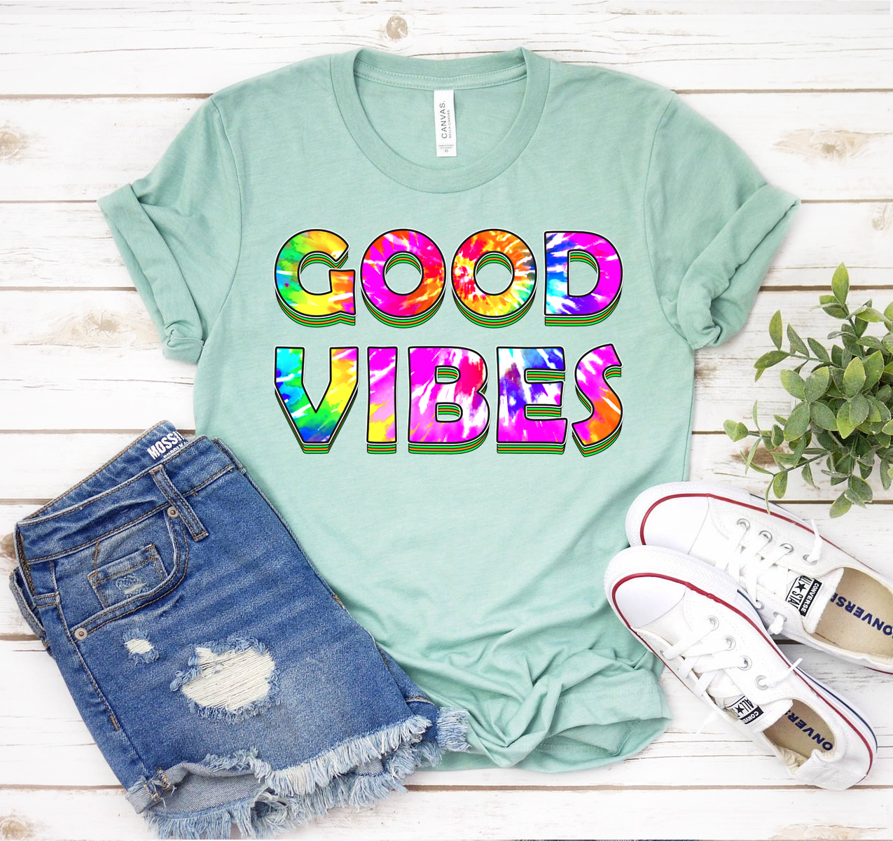 Good Vibes T-shirt in various colors, showcasing its unisex design and soft fabric.