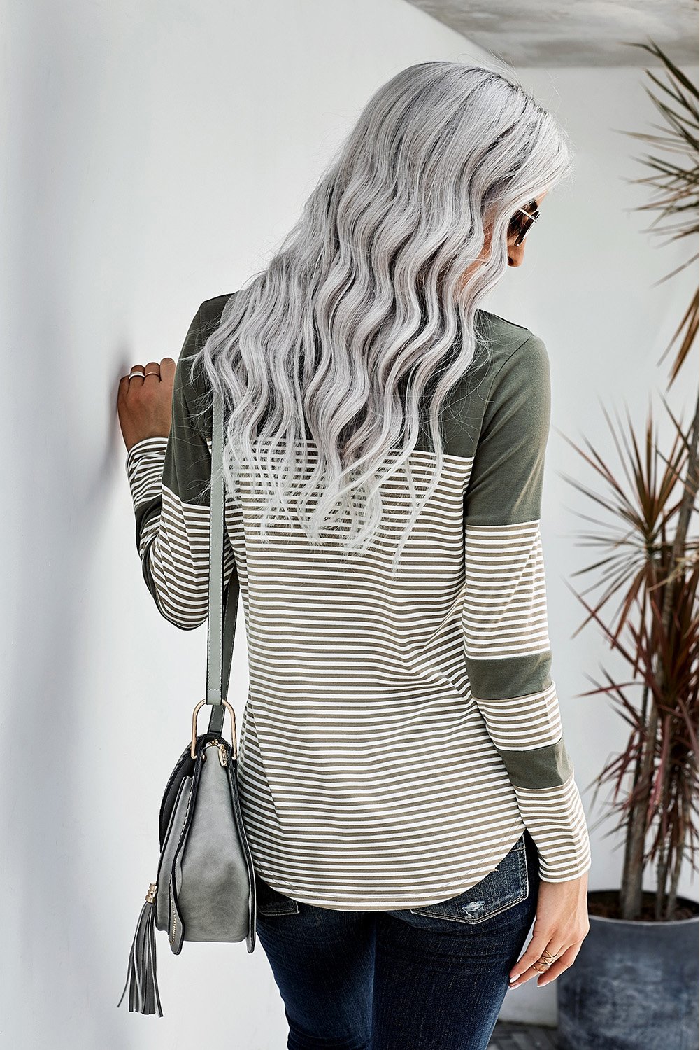 Green pinstripe long sleeve top with patch pocket, featuring a round neckline and stylish design.