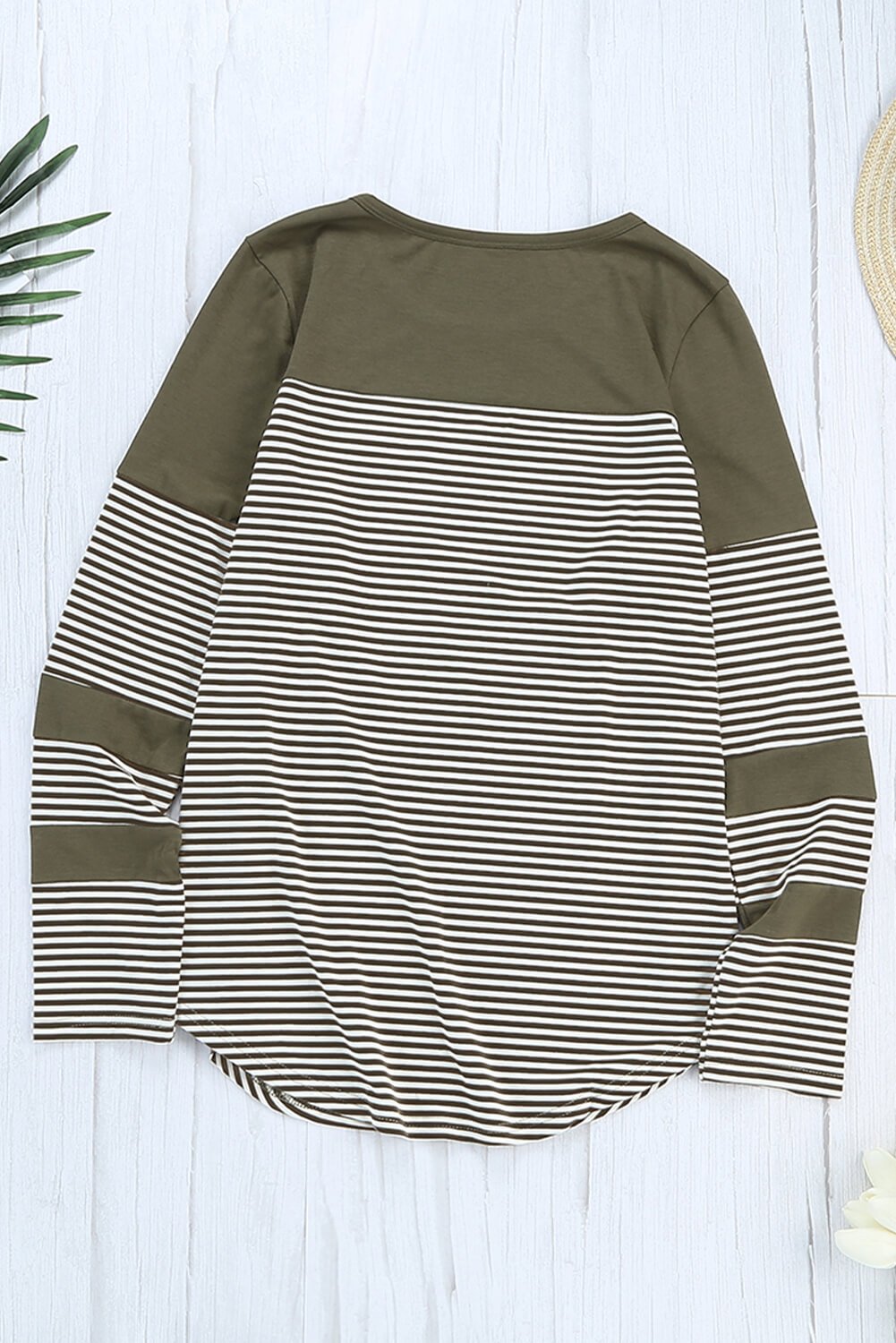 Green pinstripe long sleeve top with patch pocket, featuring a round neckline and stylish design.