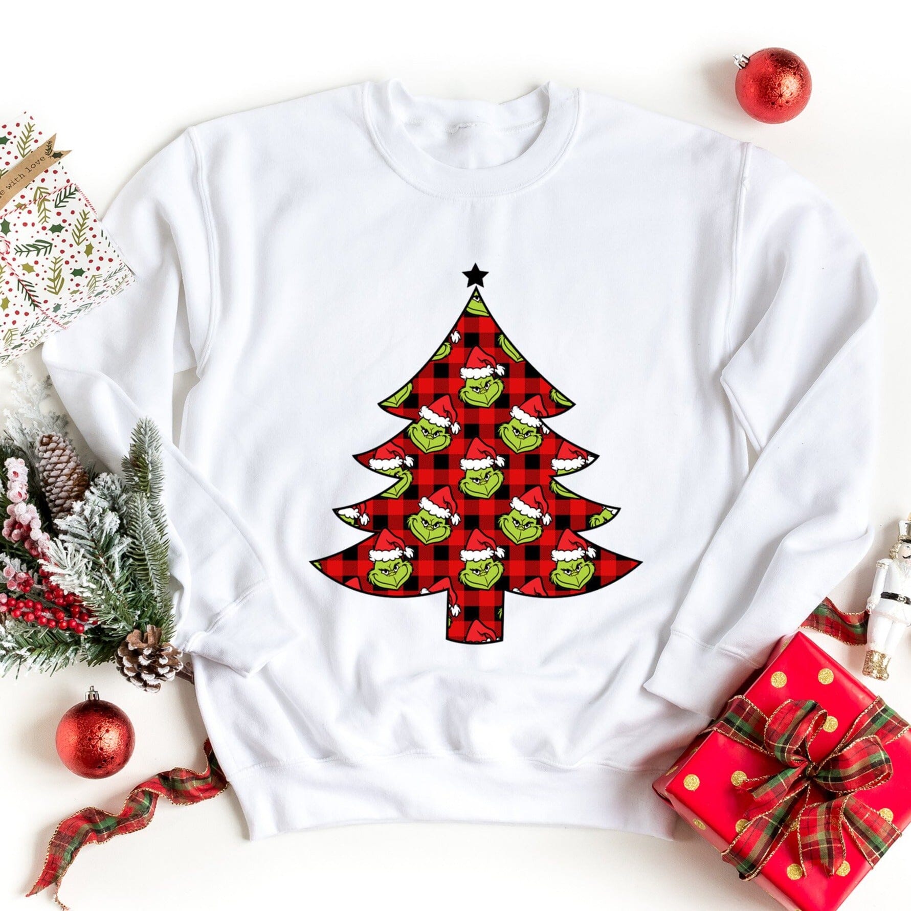 A cozy Grinch Tree Sweatshirt featuring a festive design, perfect for holiday celebrations and casual wear.