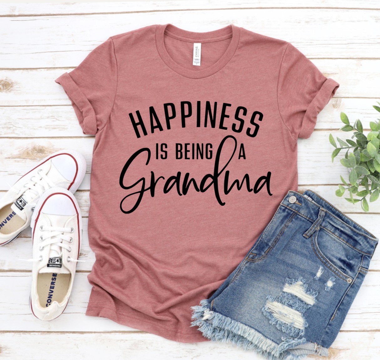 Happiness Is Being A Grandma T-shirt in various sizes, showcasing its soft fabric and vibrant print.