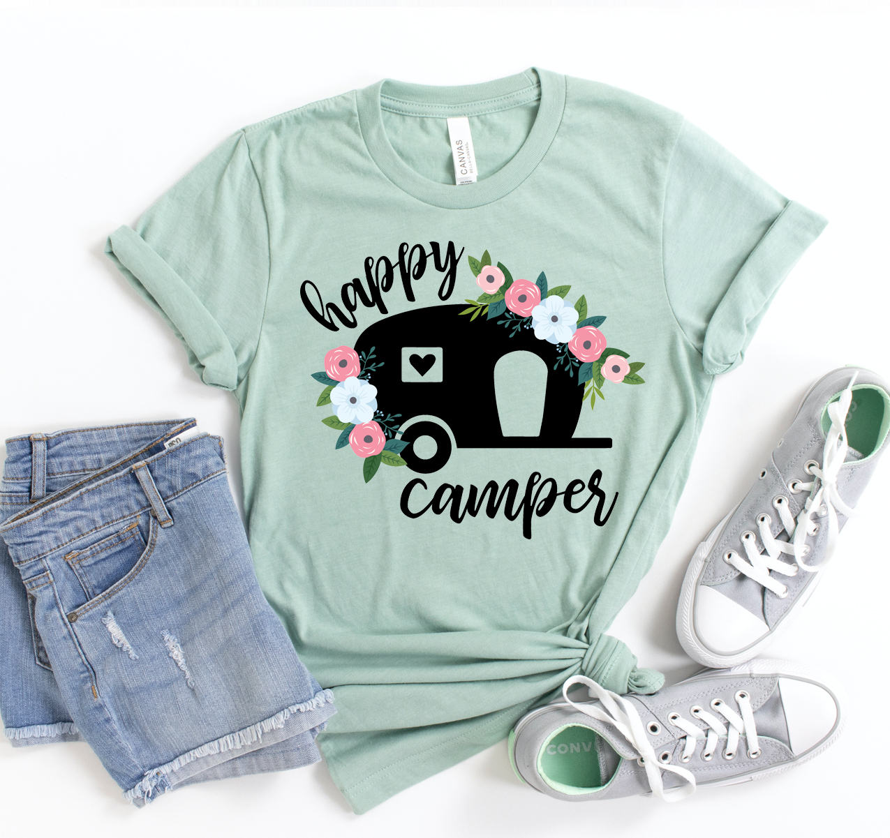 Happy Camper T-shirt in various sizes, showcasing its soft fabric and unisex design.