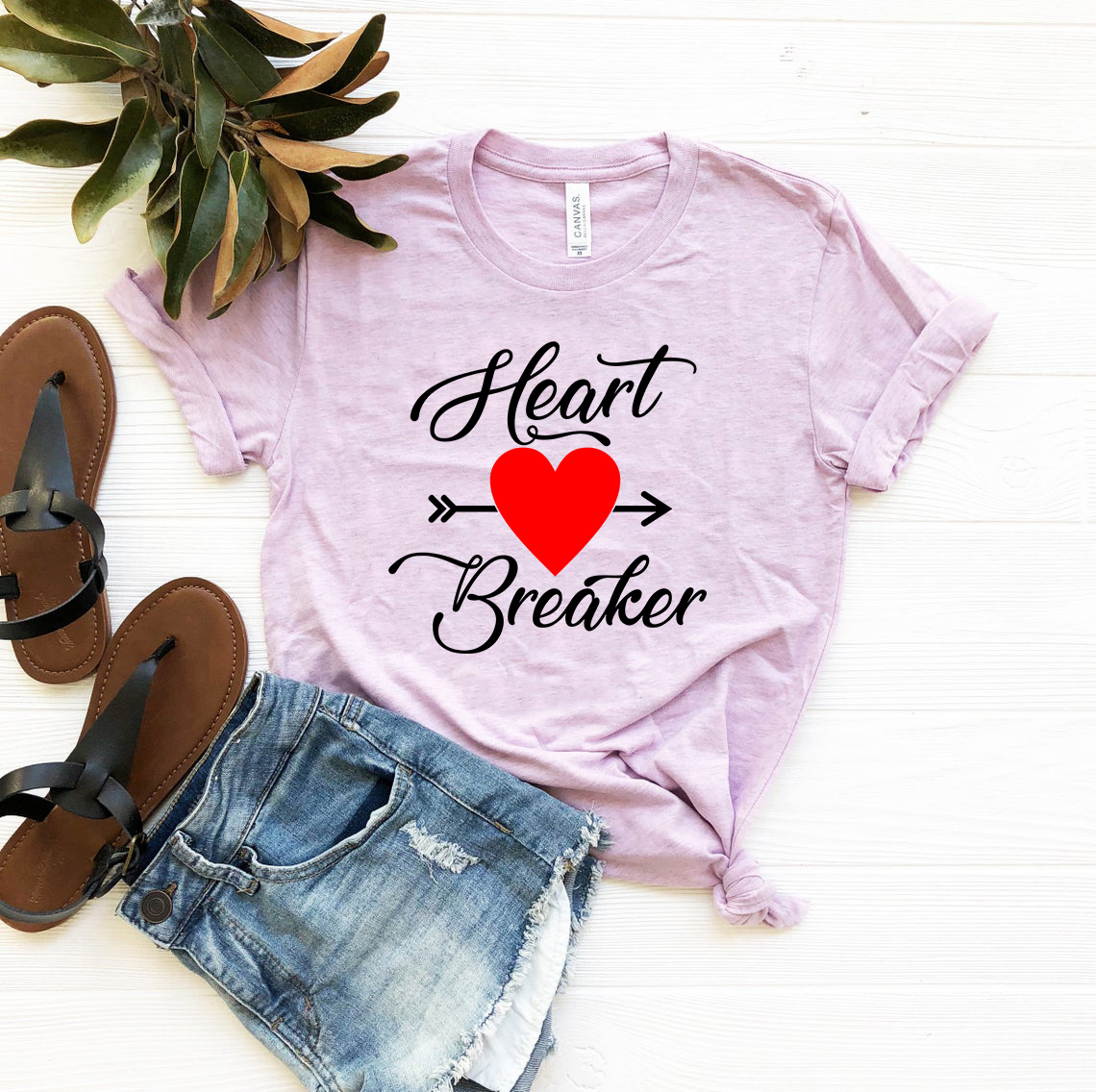 Heart Breaker Shirt in various colors, showcasing its unisex design and soft fabric.