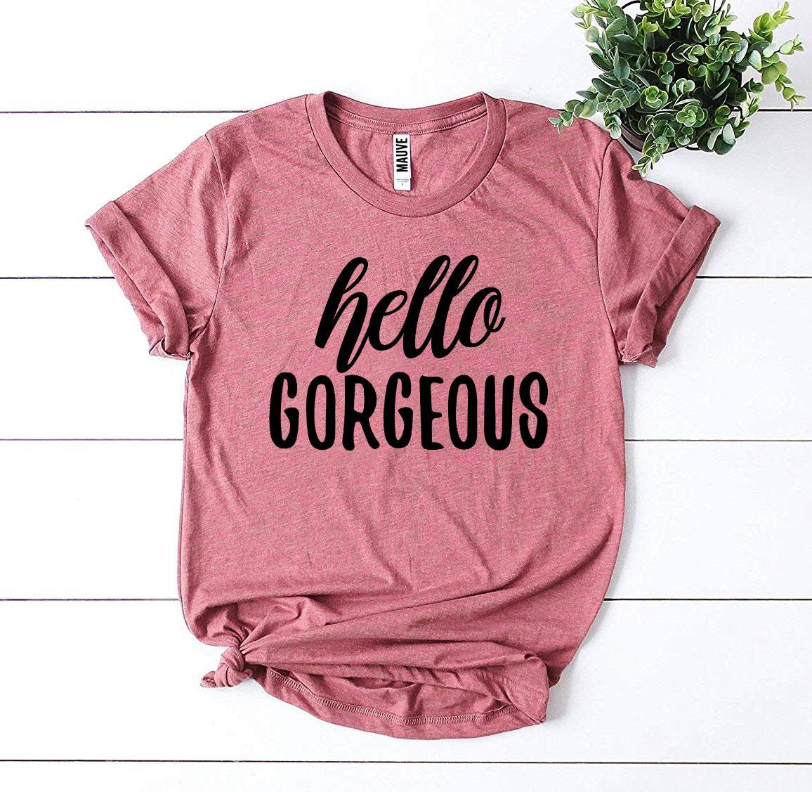 Hello Gorgeous T-shirt made of premium ring spun cotton, featuring a soft textile flex print design in various sizes.