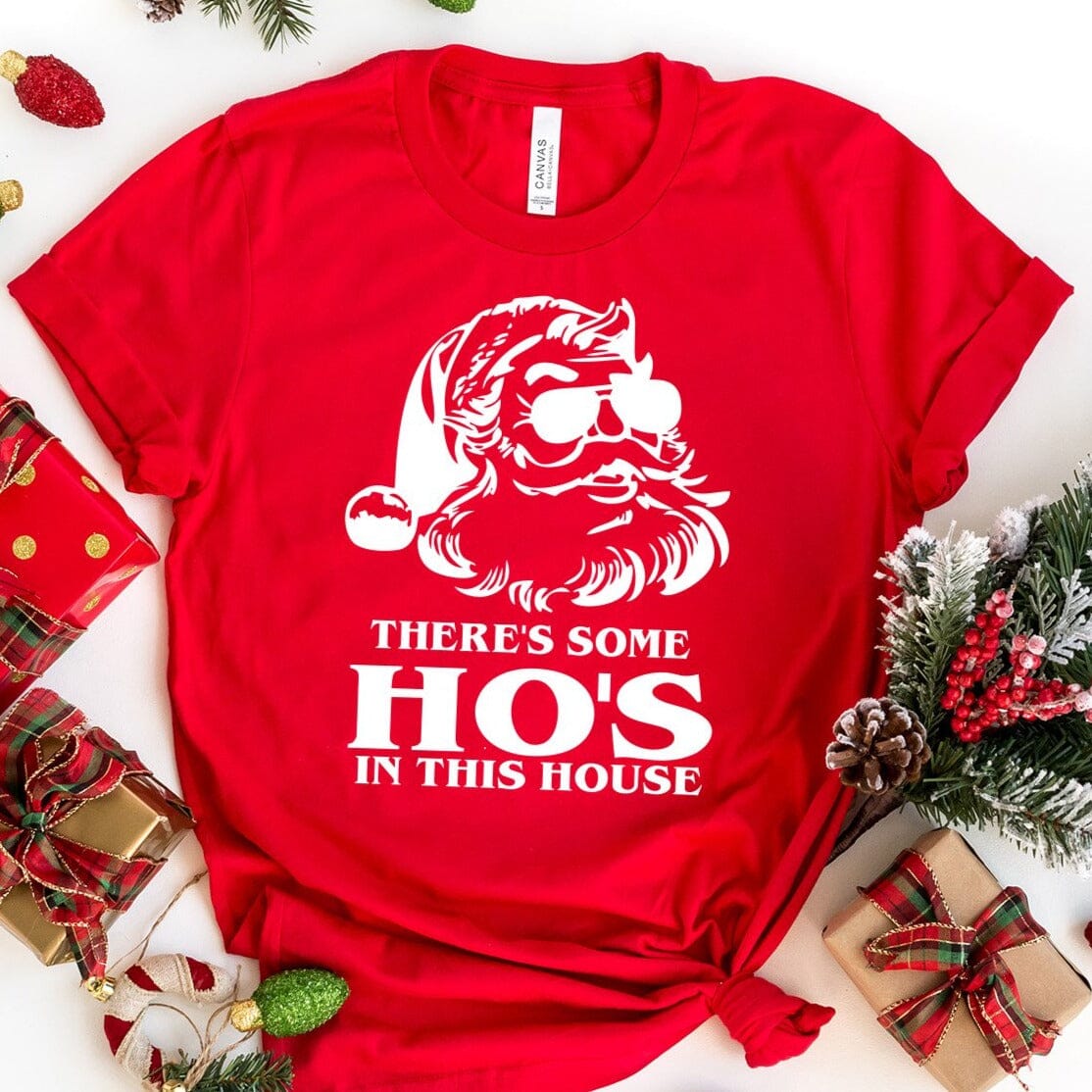 A festive Ho's In This House Christmas Tee featuring a playful design, made from soft Ringspun Cotton, perfect for holiday celebrations.