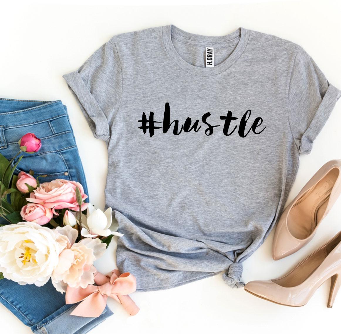 A stylish #Hustle T-shirt made from premium ring spun cotton, featuring a soft textile flex print design.