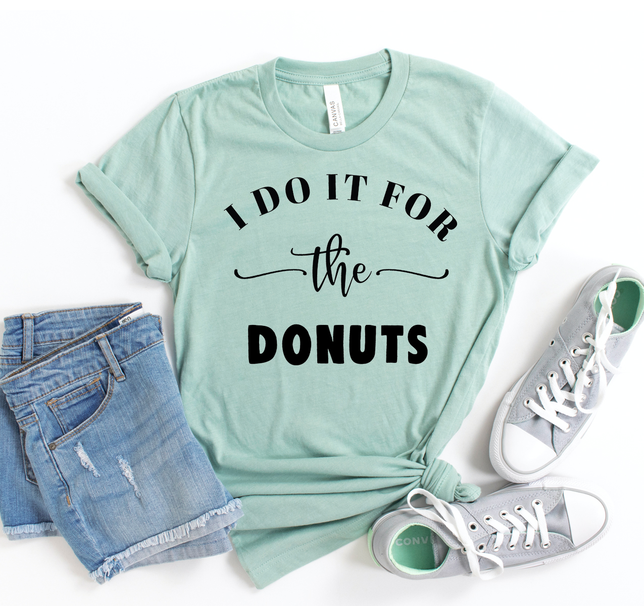 I Do It For The Donuts T-shirt in various sizes, showcasing its unisex design and soft fabric.