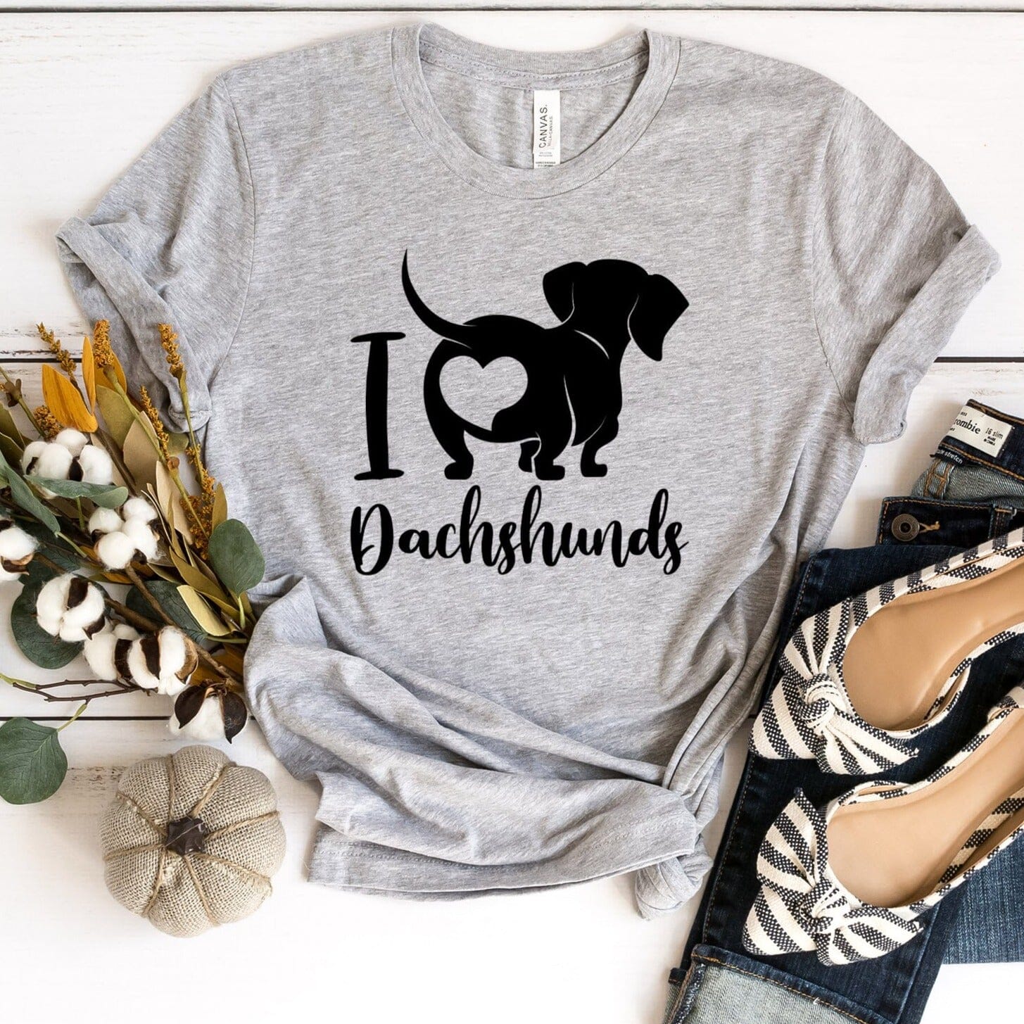 A stylish I Love Dachshunds Tee featuring a cute dachshund graphic, made from soft cotton fabric, perfect for dog lovers.