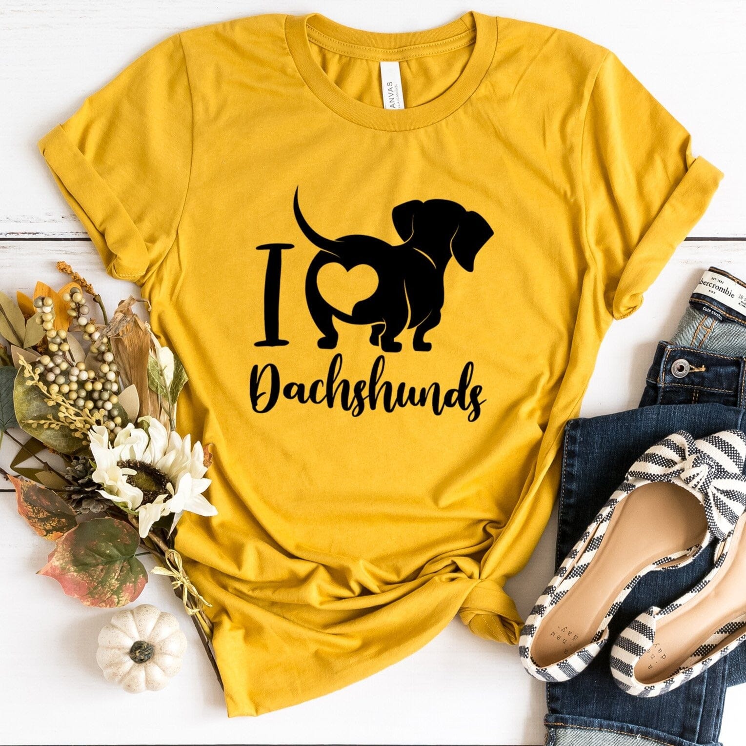 A stylish I Love Dachshunds Tee featuring a cute dachshund graphic, made from soft cotton fabric, perfect for dog lovers.