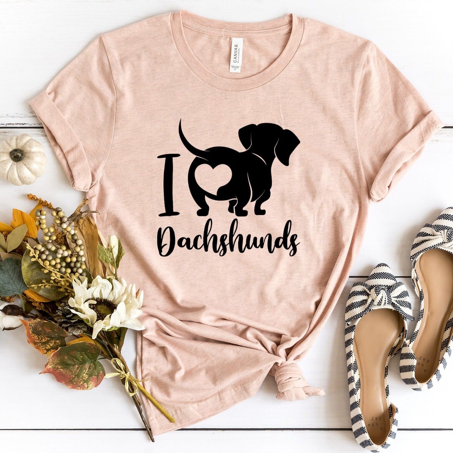 A stylish I Love Dachshunds Tee featuring a cute dachshund graphic, made from soft cotton fabric, perfect for dog lovers.