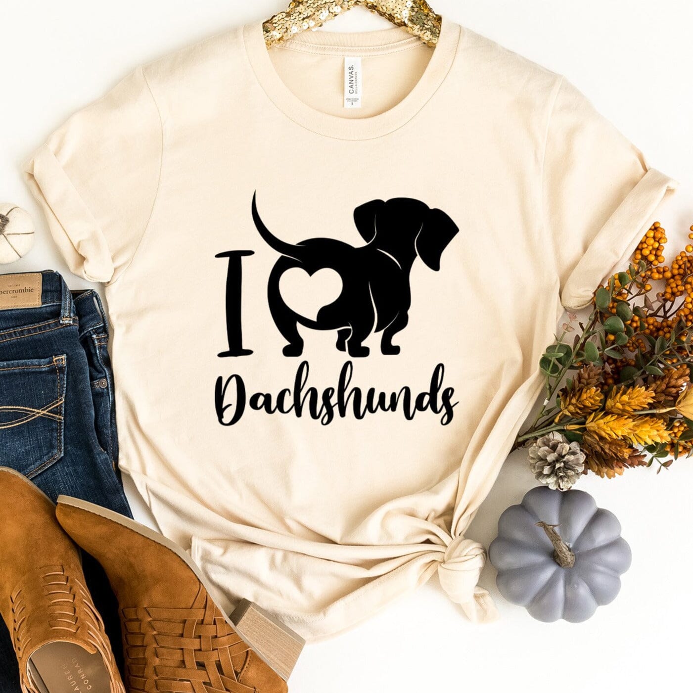 A stylish I Love Dachshunds Tee featuring a cute dachshund graphic, made from soft cotton fabric, perfect for dog lovers.