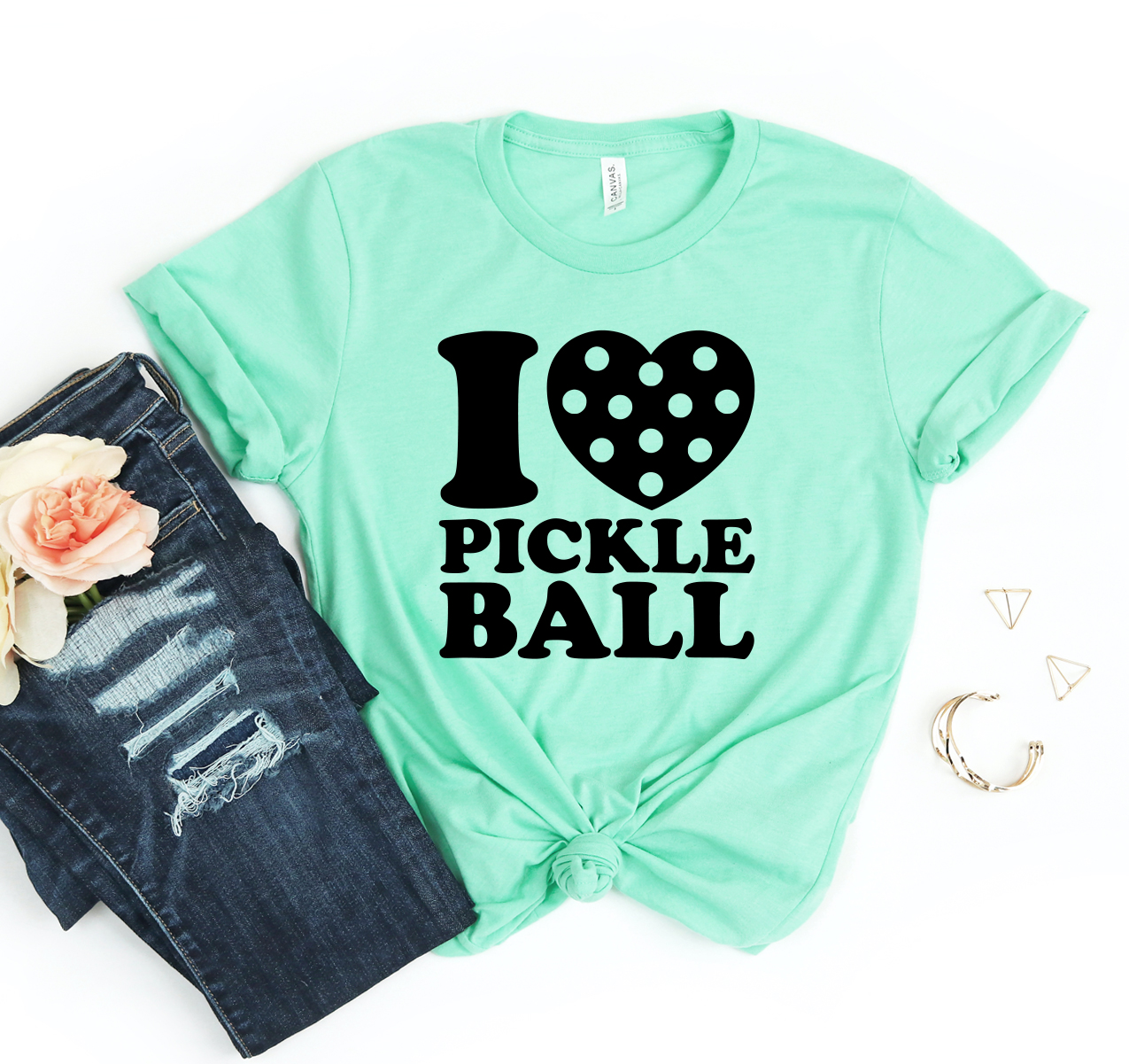 I Love Pickle Ball T-shirt in various sizes, showcasing its unisex design and soft fabric.