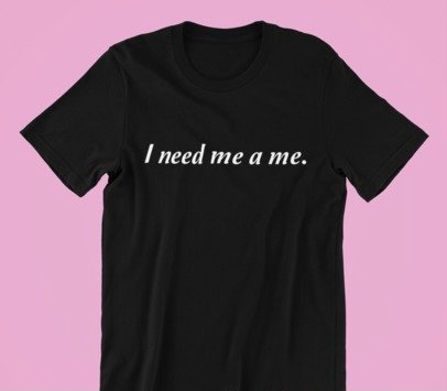 A stylish unisex shirt featuring the phrase 'I Need Me A Me' printed on high-quality cotton fabric, showcasing its classic fit and comfortable design.