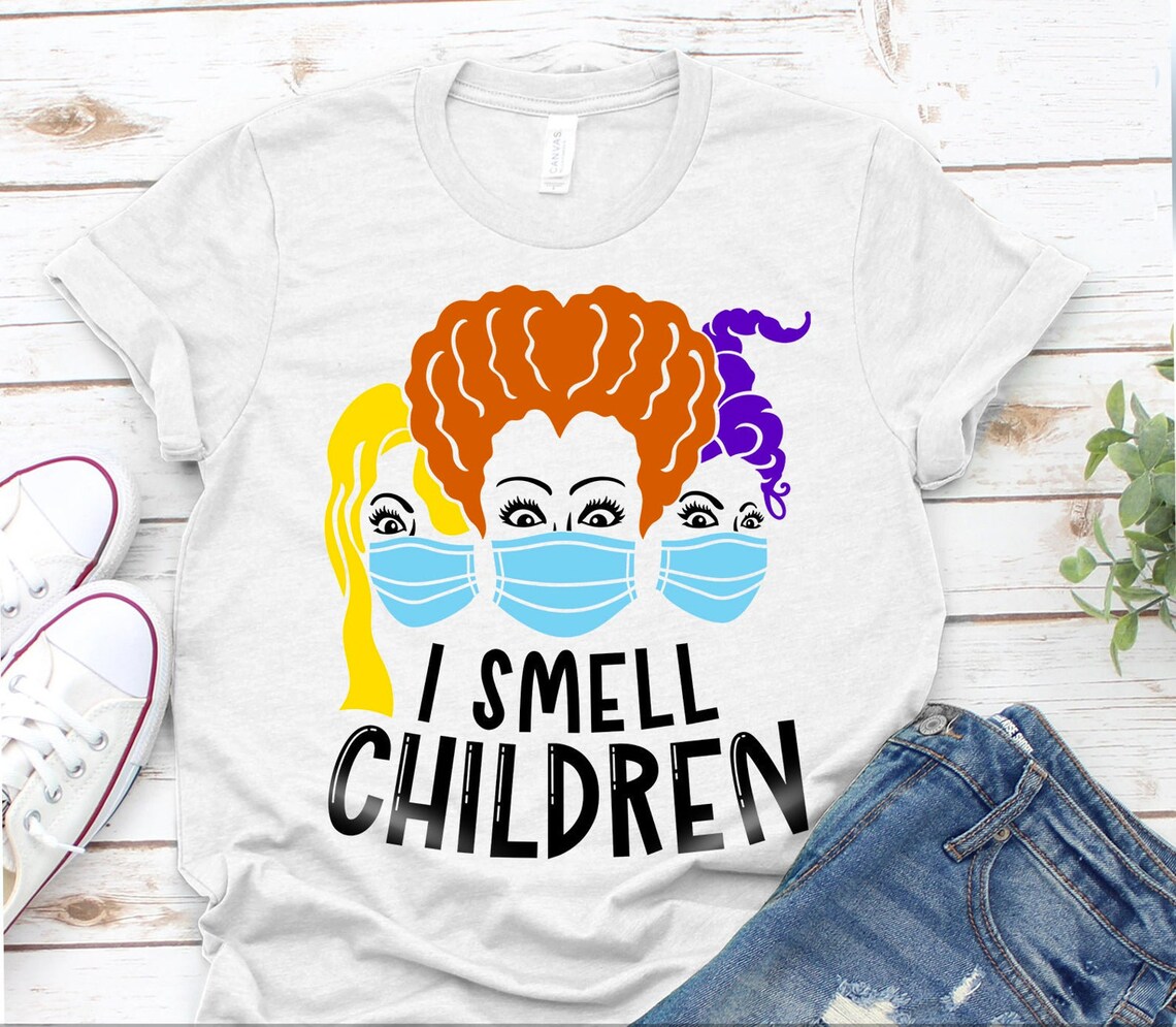 I Smell Children Halloween T-shirt featuring humorous design on premium cotton fabric.