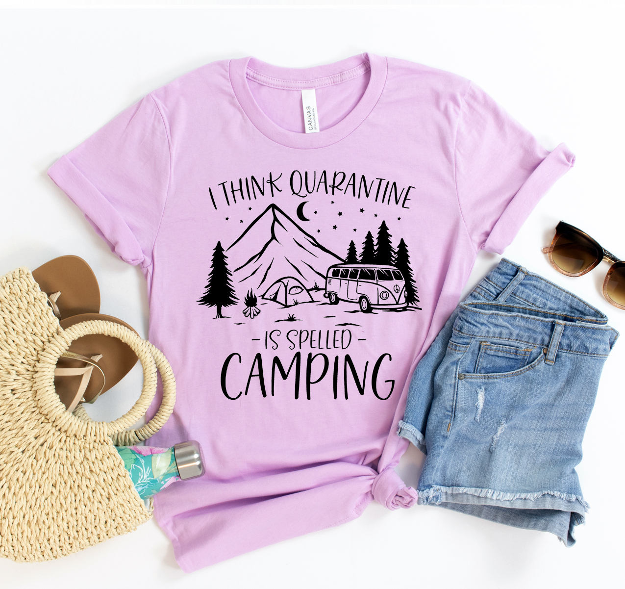 A unisex T-shirt featuring the slogan 'I Think Quarantine Is Spelled Camping' in a fun, bold font, perfect for camping enthusiasts.