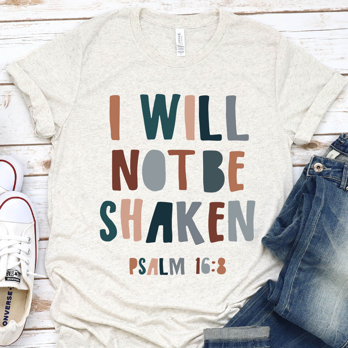 I Will Not Be Shaken Tee featuring a loose unisex fit, soft fabric, and inspirational design, perfect for casual wear.