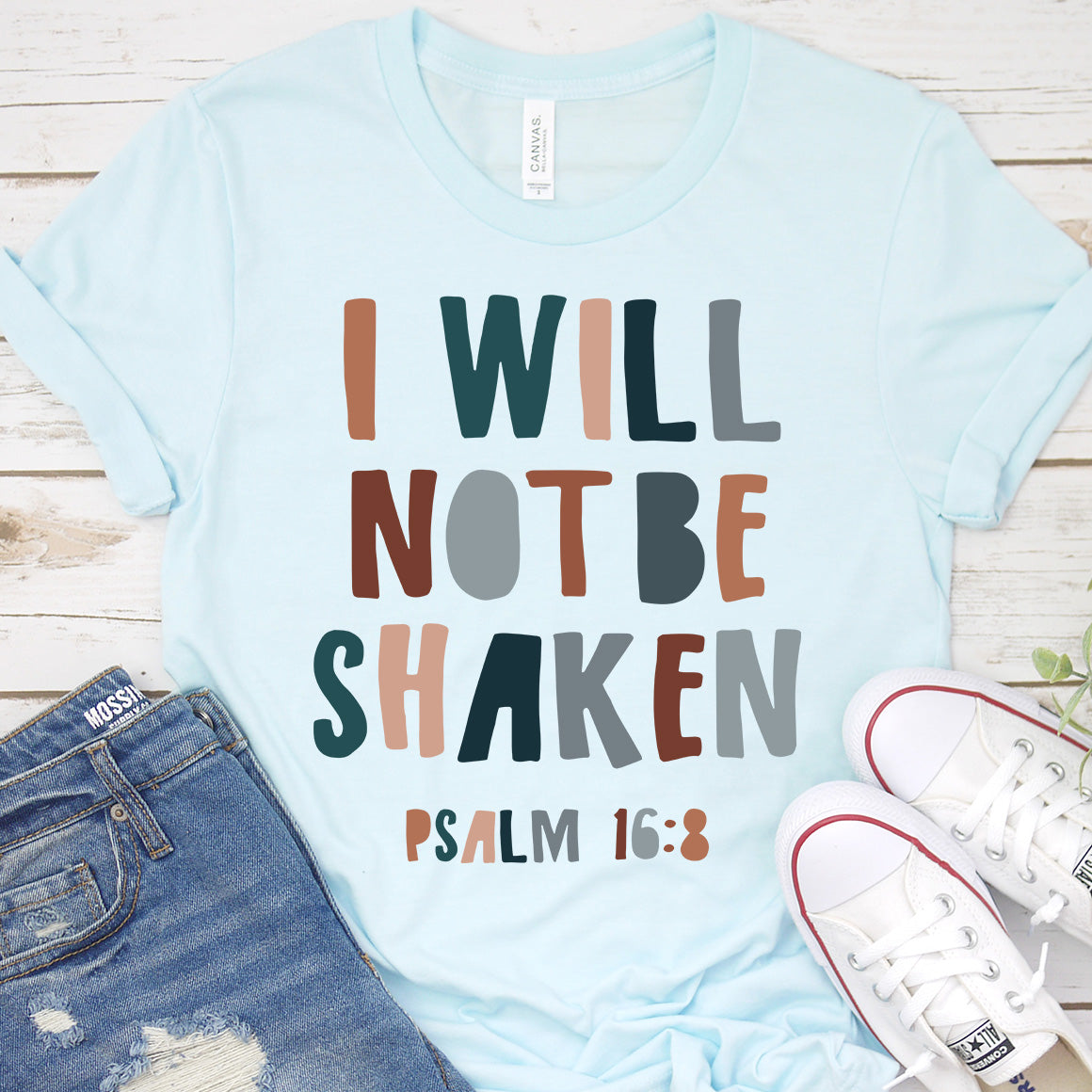 I Will Not Be Shaken Tee featuring a loose unisex fit, soft fabric, and inspirational design, perfect for casual wear.