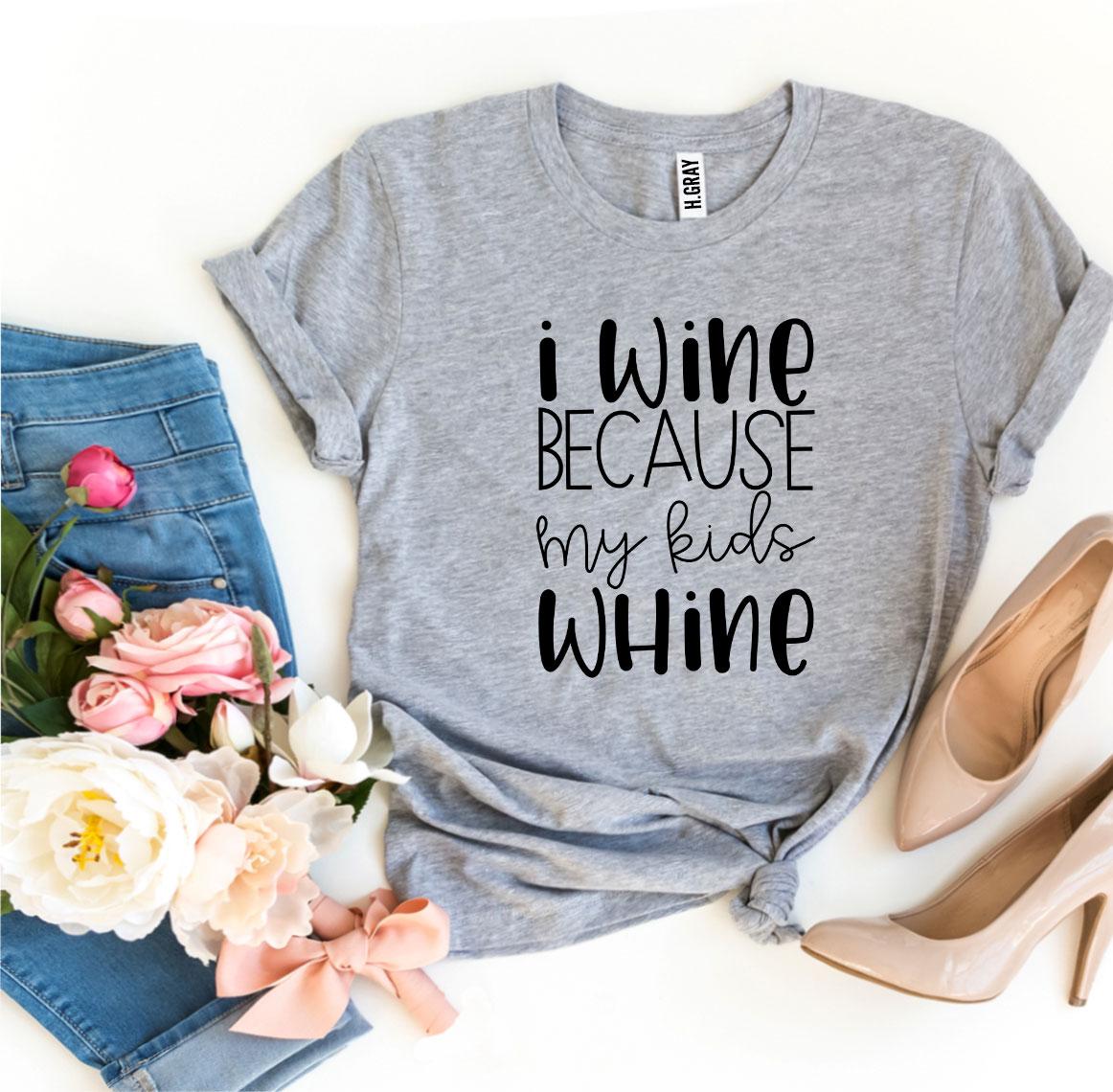 A humorous T-shirt with the phrase 'I Wine Because My Kids Whine', made from soft ring spun cotton, showcasing a stylish design.