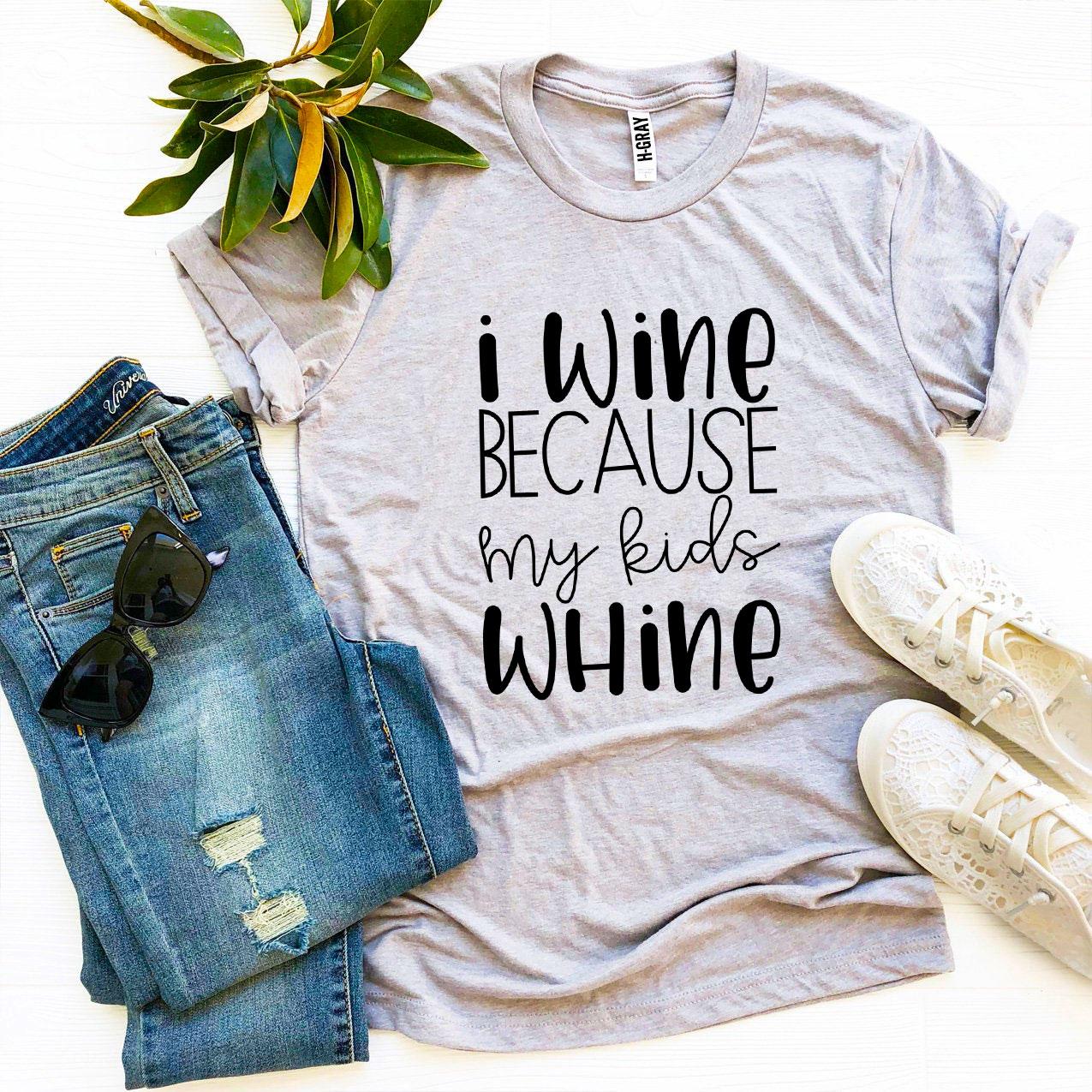 A humorous T-shirt with the phrase 'I Wine Because My Kids Whine', made from soft ring spun cotton, showcasing a stylish design.