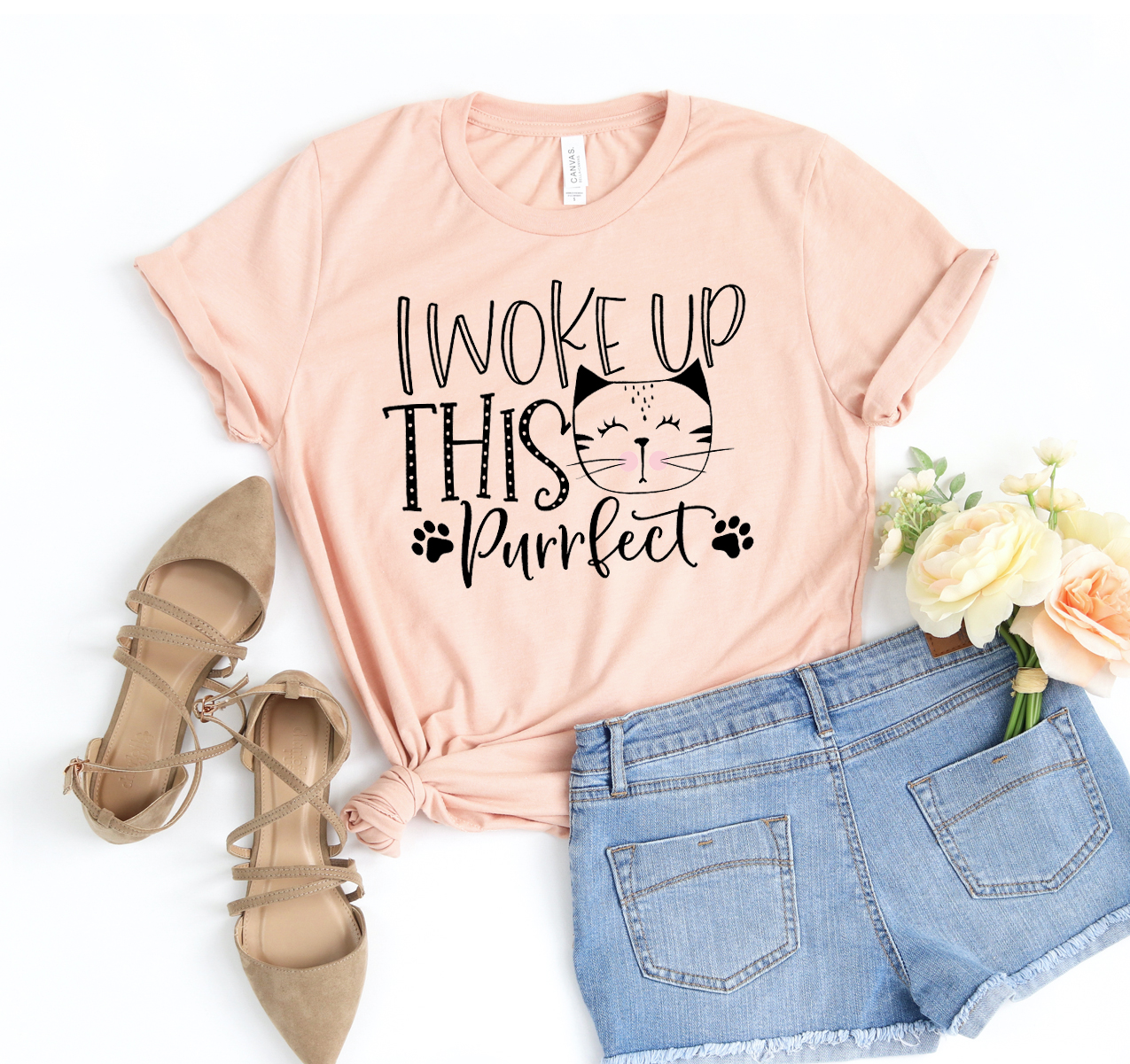 I Woke Up This Purrfect T-shirt displayed on a hanger, showcasing its soft fabric and playful design.