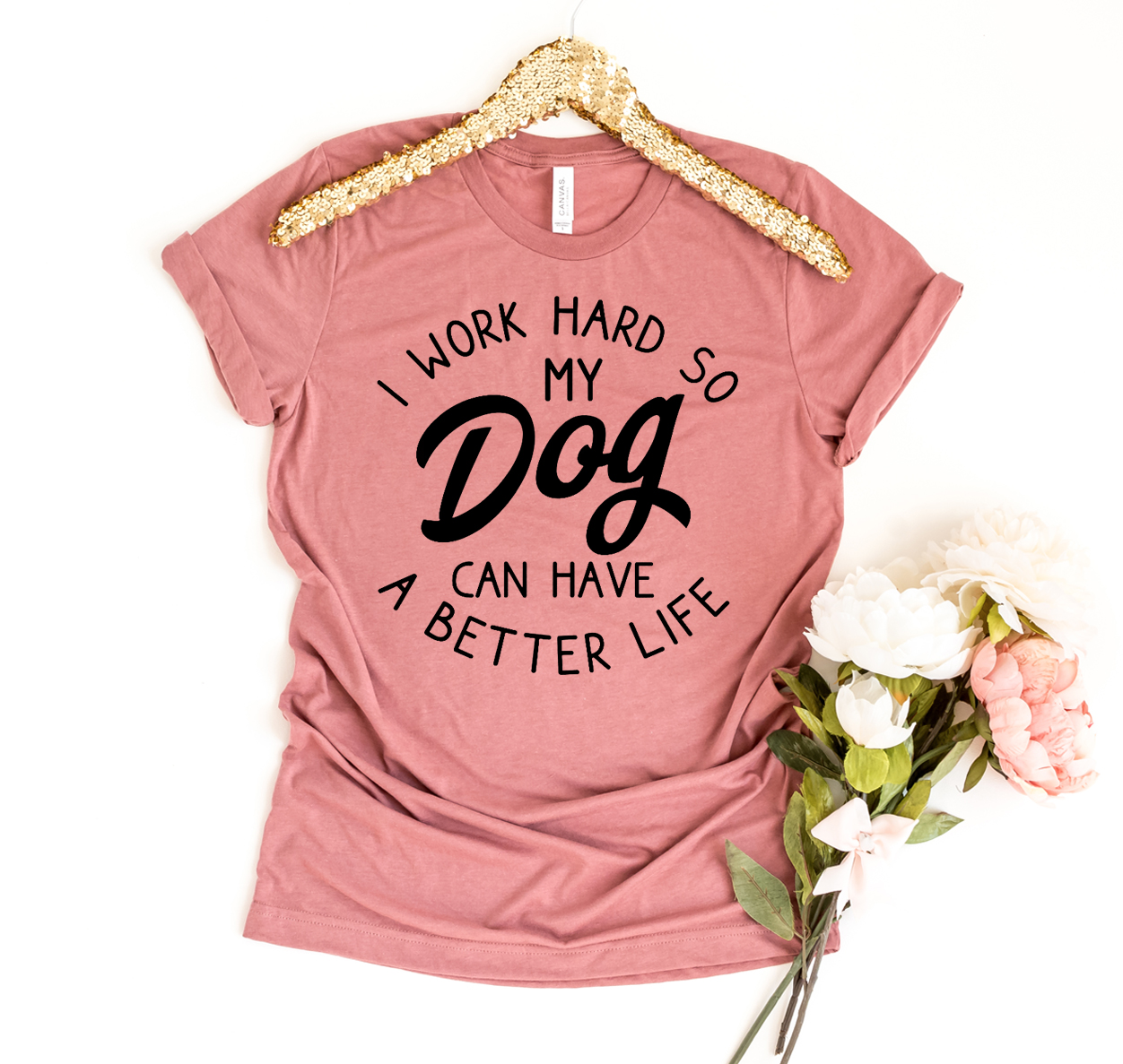 A comfortable and stylish T-shirt featuring the phrase 'I Work Hard So My Dog Can Have A Better Life', made from premium ring spun cotton.