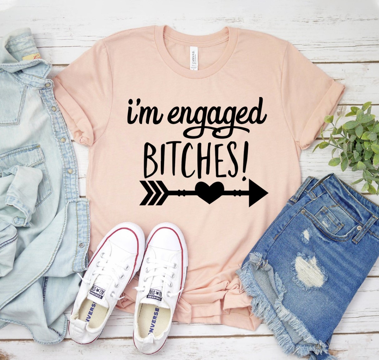 A stylish 'I'm Engaged Bitches' T-shirt made from premium ring spun cotton, featuring a bold print and available in various sizes.