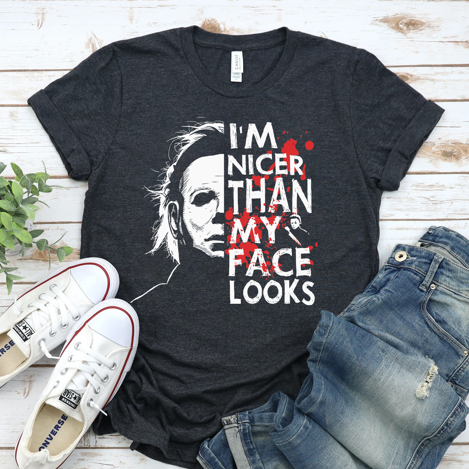 I'm Nicer Than My Face Looks Halloween T-shirt in various sizes, showcasing its soft cotton fabric and vibrant print.