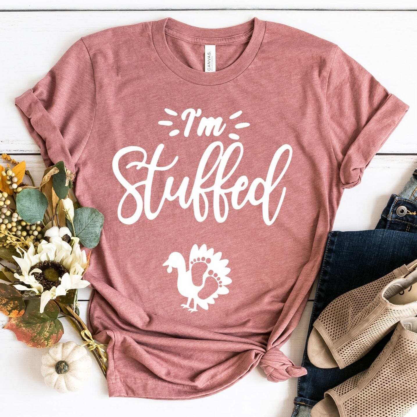 I'm Stuffed Pregnancy Tee in a soft cotton fabric, featuring a fun design perfect for expecting mothers, available in various sizes.