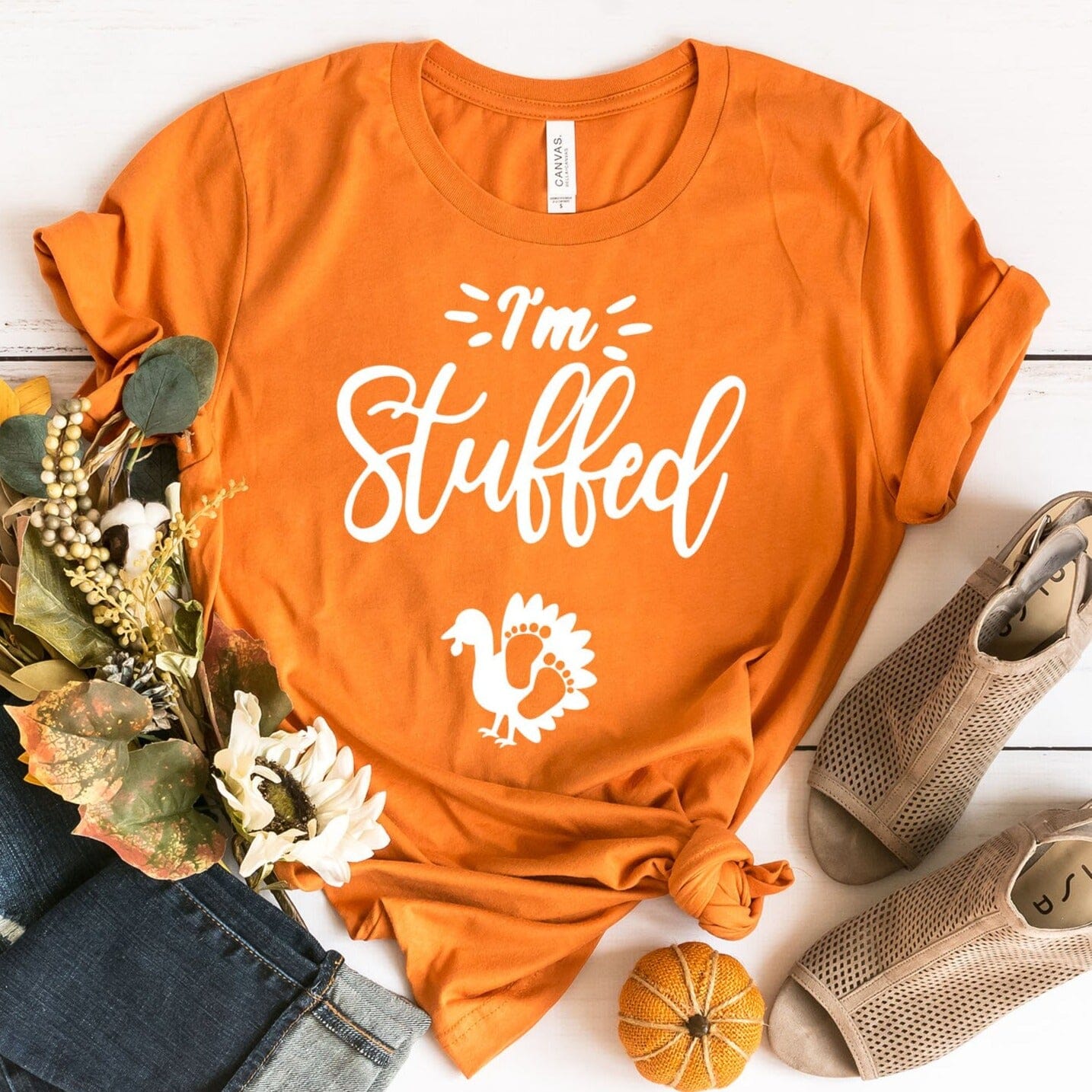 I'm Stuffed Pregnancy Tee in a soft cotton fabric, featuring a fun design perfect for expecting mothers, available in various sizes.