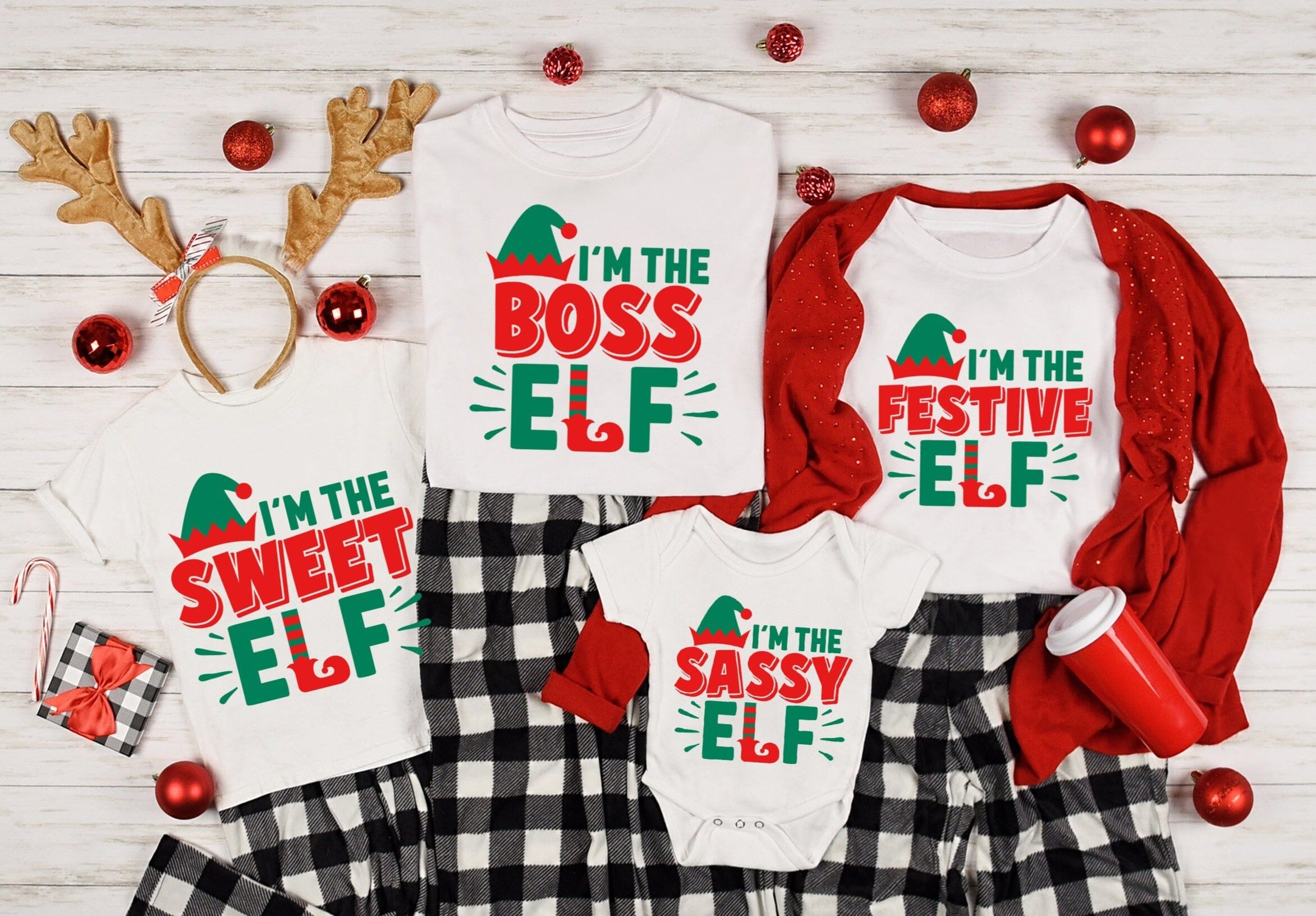 I'm The Boss Elf Christmas Tee featuring a playful design, made from soft ringspun cotton, suitable for both men and women.