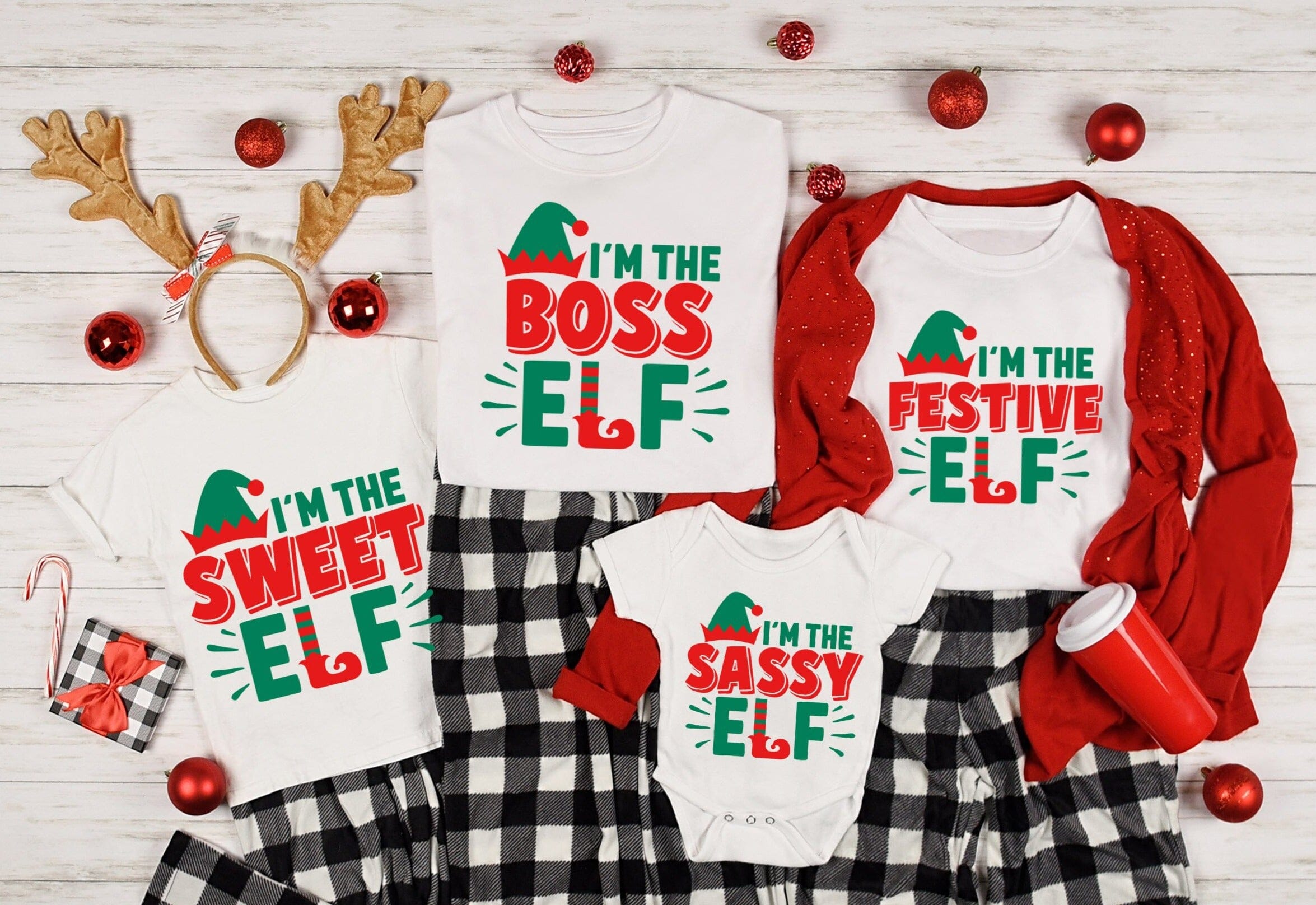 Toddler wearing I'm The Boss Elf Christmas Tee, featuring festive design and comfortable fit.