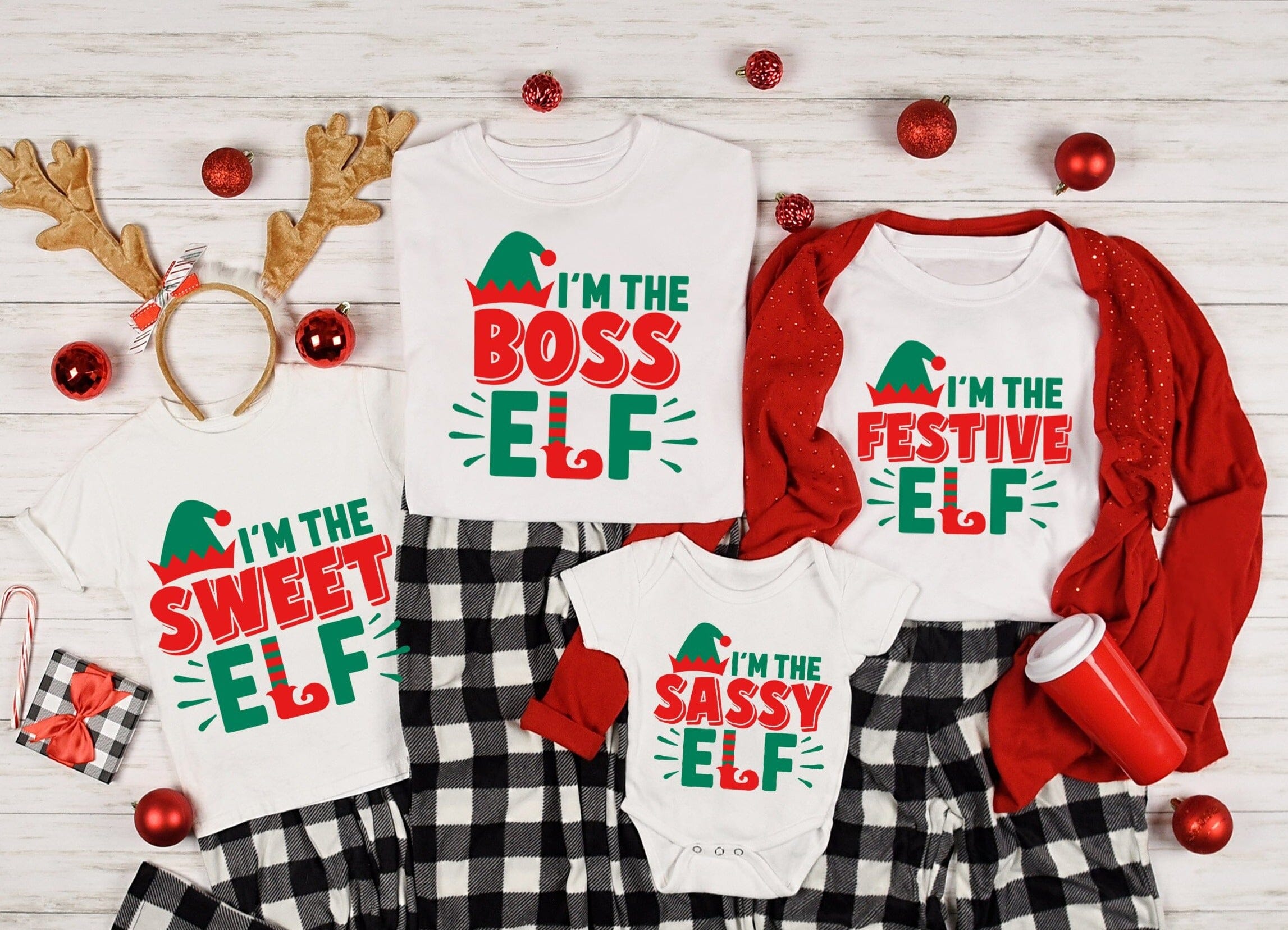 A cute elf onesie designed for babies, featuring a playful design and comfortable fit, perfect for group photos and cozy wear.