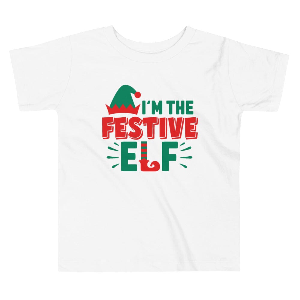 A cheerful toddler wearing the I'm The Festive Elf Christmas Tee, featuring a festive elf design, perfect for holiday celebrations.