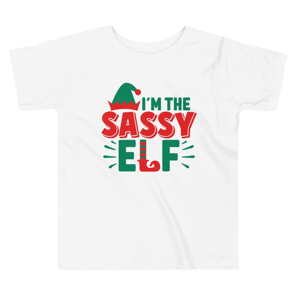 A toddler wearing the I'm The Sassy Elf Christmas Tee, showcasing a playful design perfect for the holiday season.