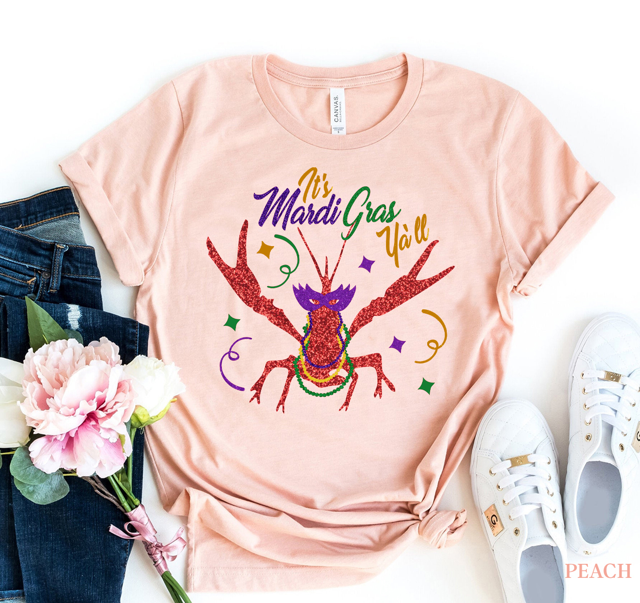 A vibrant 'It's Mardi Gras Y'all' T-shirt made from premium ring spun cotton, featuring a colorful design perfect for Mardi Gras celebrations.