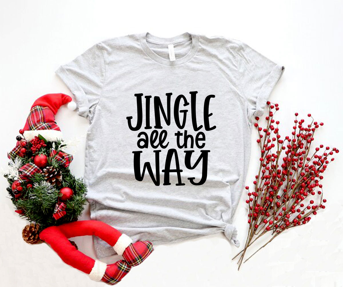 A festive unisex T-shirt featuring the phrase 'Jingle All The Way' in vibrant print, made from soft ring spun cotton.