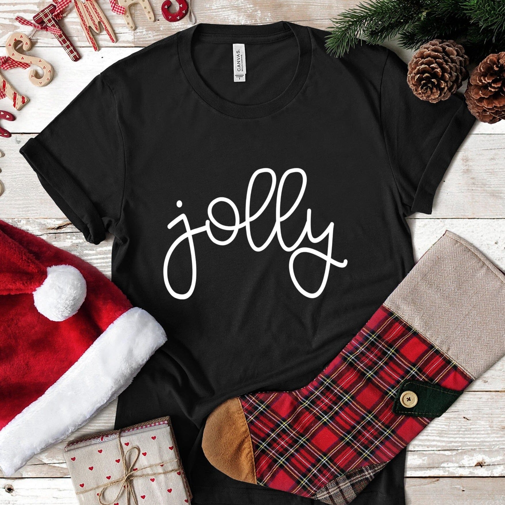 A festive Jolly Christmas Tee featuring a cheerful design, made from soft ringspun cotton, perfect for holiday celebrations.