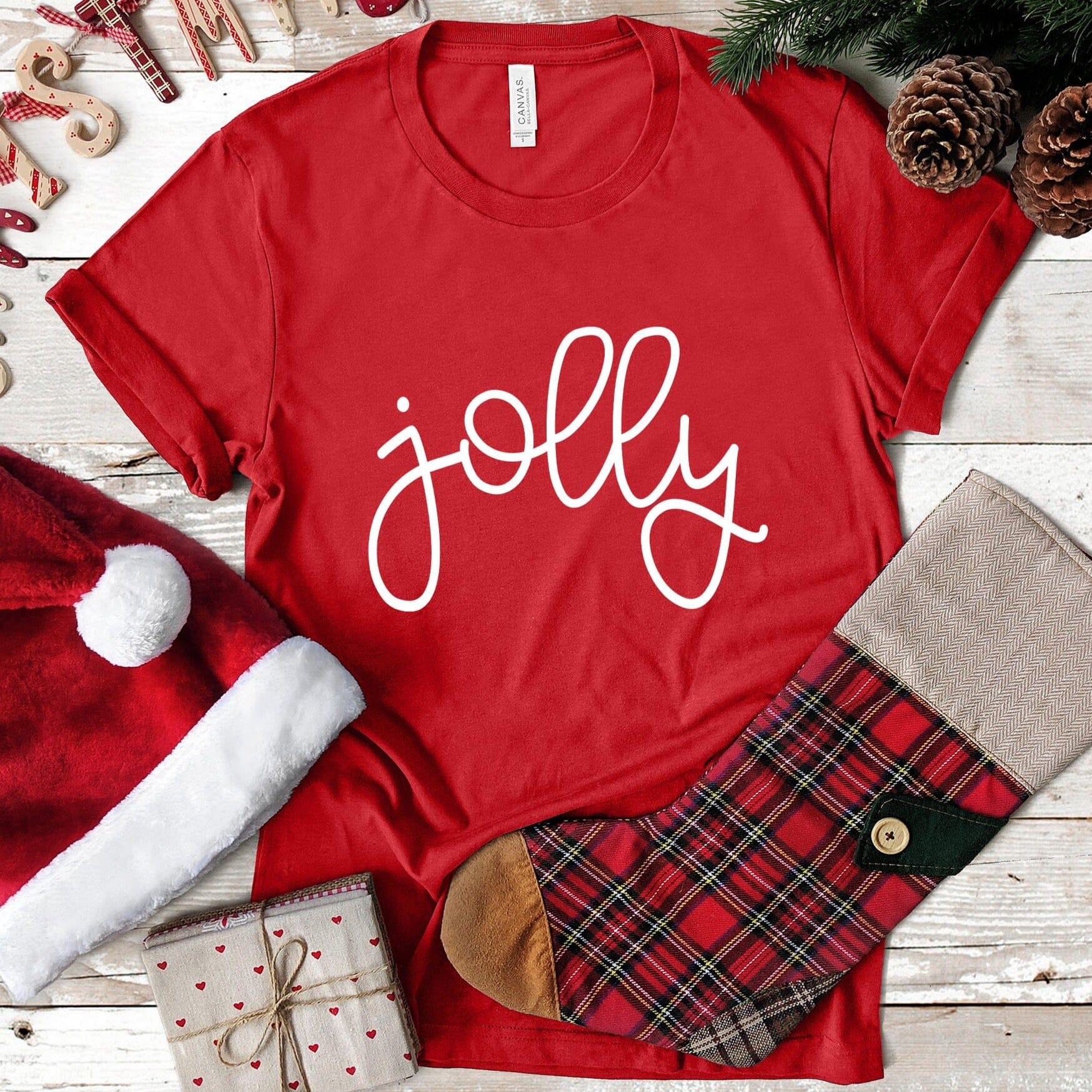 A festive Jolly Christmas Tee featuring a cheerful design, made from soft ringspun cotton, perfect for holiday celebrations.