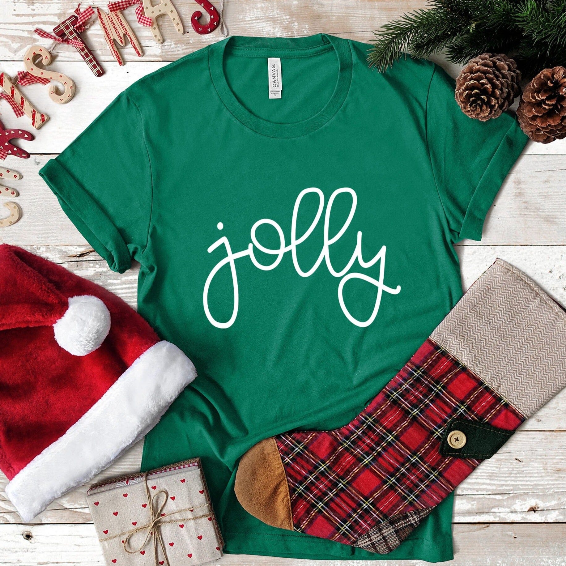 A festive Jolly Christmas Tee featuring a cheerful design, made from soft ringspun cotton, perfect for holiday celebrations.