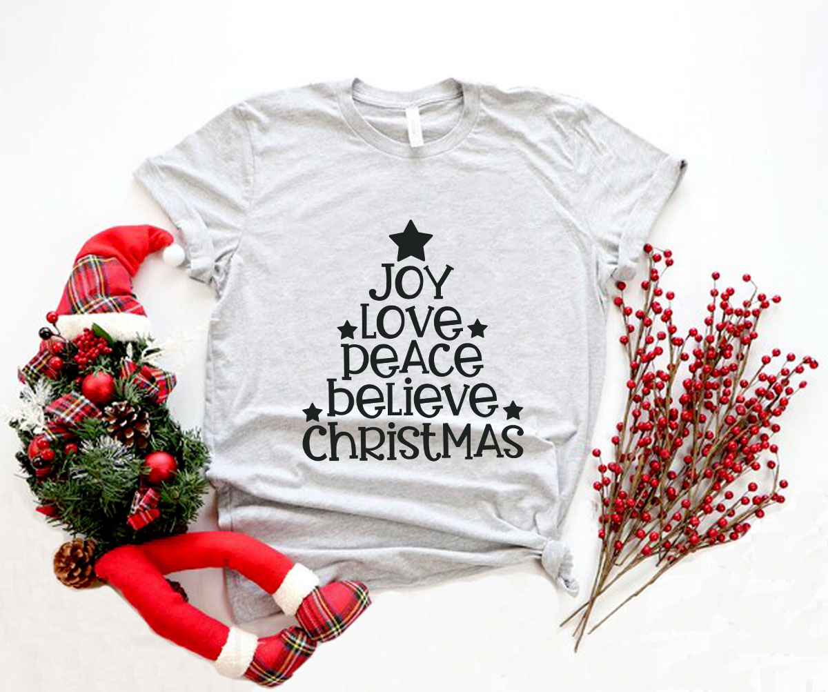 Joy Love Peace Believe Christmas Shirt in various colors, showcasing its soft fabric and stylish design.