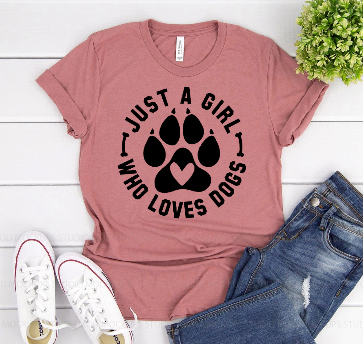 A stylish t-shirt featuring the phrase 'Just A Girl Who Loves Dogs', made from soft ring spun cotton with a comfortable fit.