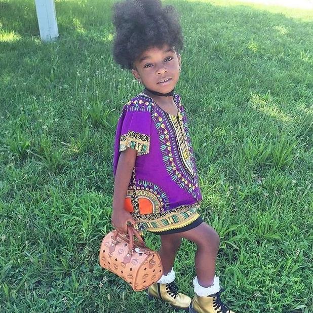 A vibrant purple Kid's Dashiki Shirt made of cotton, featuring traditional dashiki design, perfect for children.