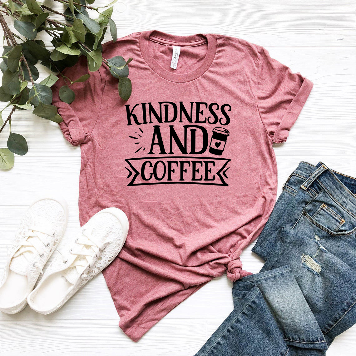 A unisex Kindness And Coffee Shirt displayed in various colors, showcasing its soft fabric and stylish design.